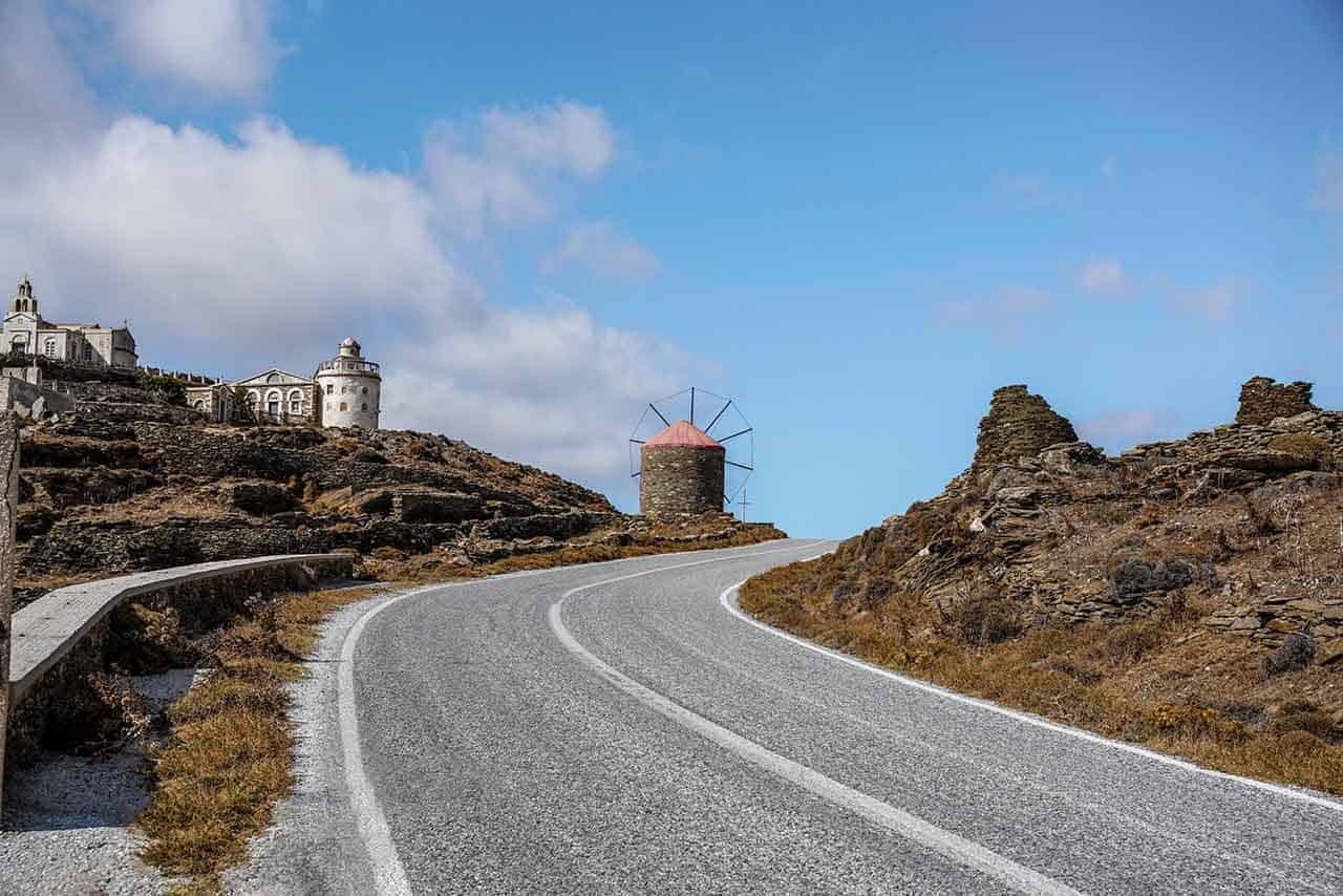 Mountain road in Tinos leading to an old windmill